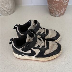 Gently used but clean up great 8.5C
Nike Kids Black and Cream Sneakers